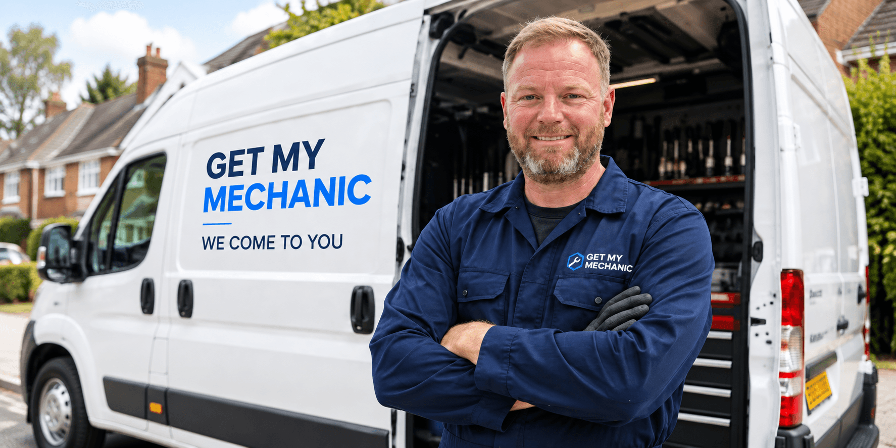 A Get My Mechanic mobile mechanic standing in front of his liveried van